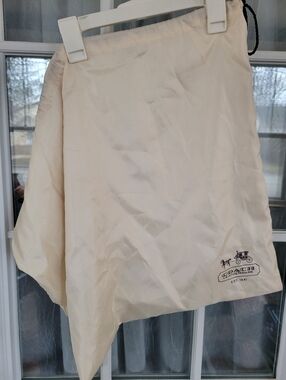 Coach Cream Asymmetrical Skirt Dust Cover